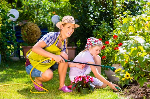 Supervisor conducting a site-specific risk assessment in an urban garden