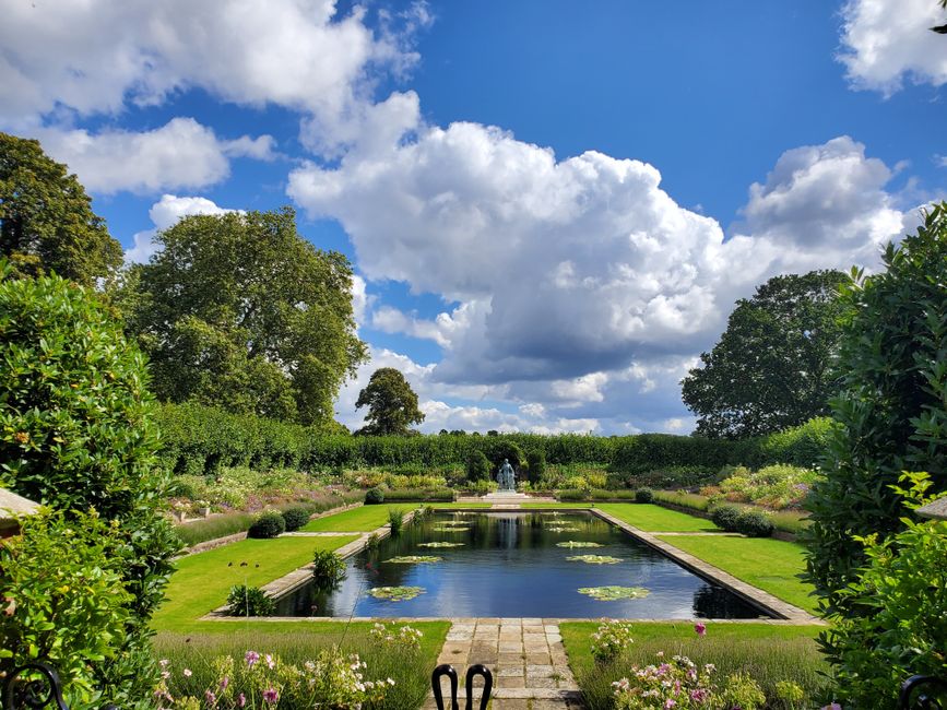 An aerial view of the historic garden at the Royal Hospital Chelsea, featuring a symmetrical layout with four ornate, geometric garden beds bordered by neatly trimmed grass and low hedges. Central to